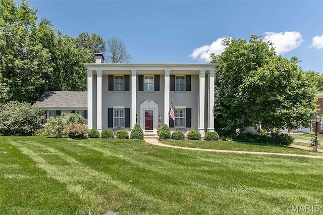 3 Deer Creek Woods, Ladue, MO 63124 - greek revival inspired property featuring a chimney, a front yard, and stucco siding