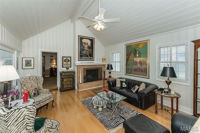 3 Deer Creek Woods, Ladue, MO 63124 - living room featuring healthy amount of natural light, ceiling fan, a brick fireplace, lofted ceiling, and wood finished floors