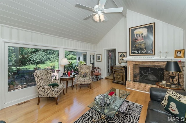 3 Deer Creek Woods, Ladue, MO 63124 - living area featuring vaulted ceiling, healthy amount of natural light, wood finished floors, a brick fireplace, and a ceiling fan