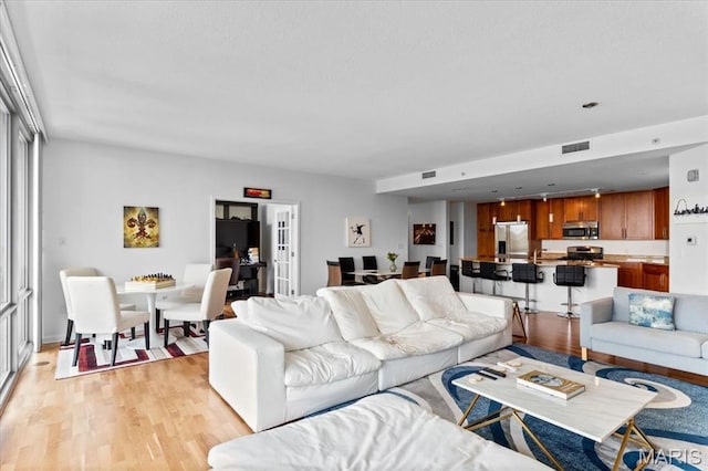 4909 Laclede Ave Unit 806, Saint Louis, MO 63108 - living area featuring light wood-style flooring