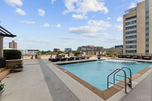 4909 Laclede Ave Unit 806, Saint Louis, MO 63108 - community pool with a view of city and a patio area