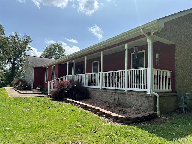 11355 Satmoore Rd, Dexter, MO 63841 - view of property exterior with a porch and a yard