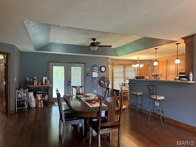 11355 Satmoore Rd, Dexter, MO 63841 - dining room featuring a raised ceiling, dark wood-style flooring, a textured ceiling, baseboards, and a ceiling fan
