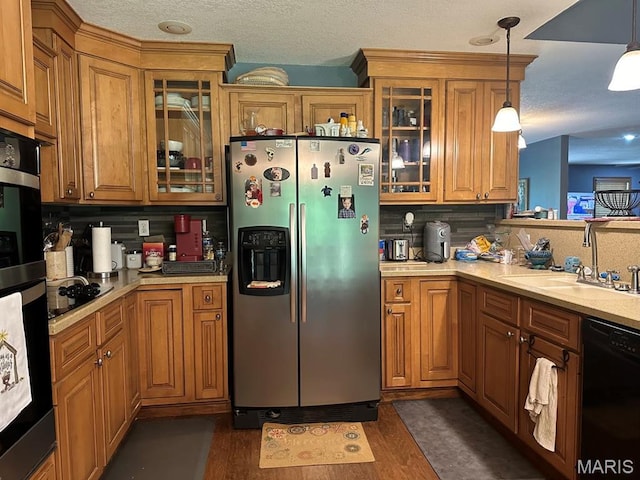 11355 Satmoore Rd, Dexter, MO 63841 - kitchen featuring black appliances, a sink, and brown cabinetry