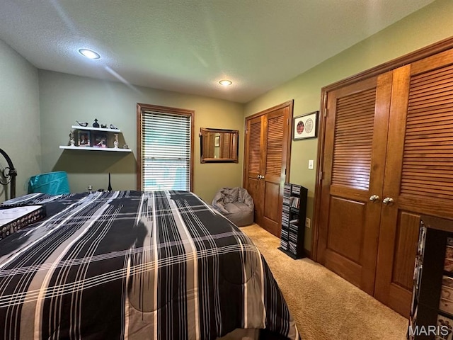 11355 Satmoore Rd, Dexter, MO 63841 - bedroom featuring light carpet, two closets, and recessed lighting