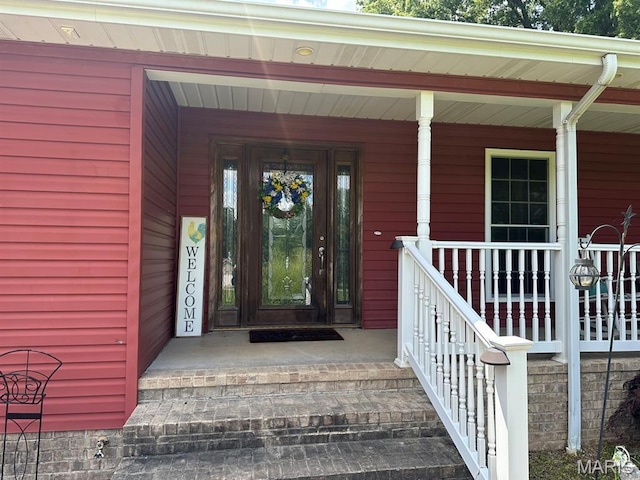 11355 Satmoore Rd, Dexter, MO 63841 - view of exterior entry with a porch