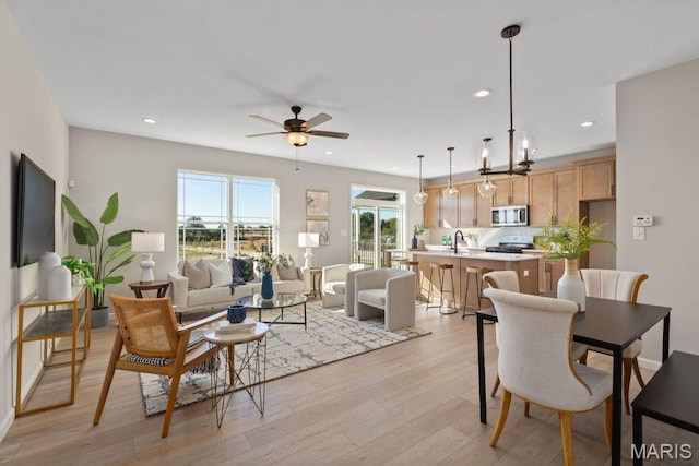 543 Wheatfield Cir, Ofallon, MO 63385 - living area with light wood-style floors, ceiling fan, and recessed lighting