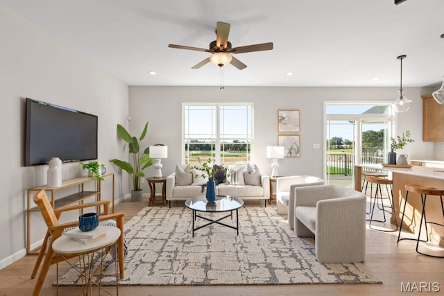 543 Wheatfield Cir, Ofallon, MO 63385 - living area featuring a ceiling fan, wood finished floors, recessed lighting, and baseboards