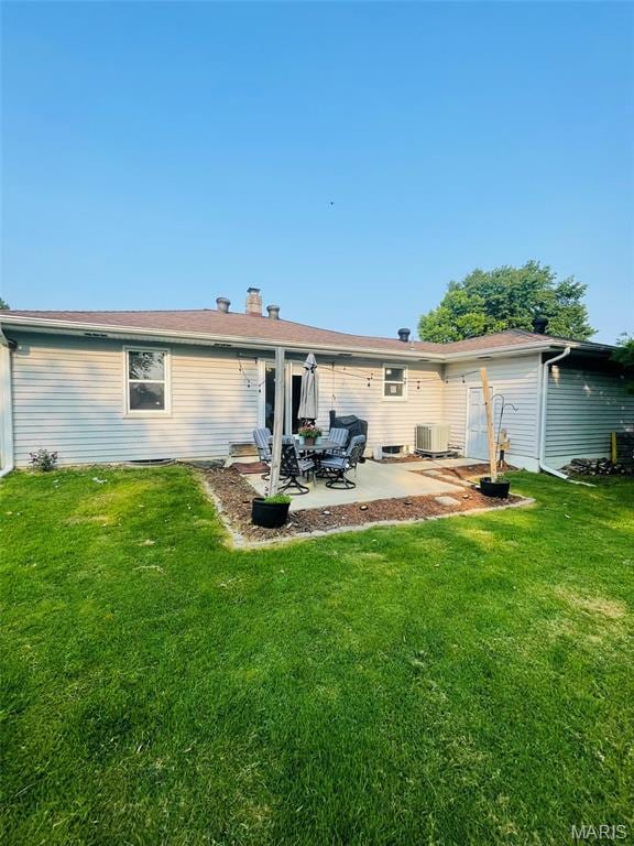 111 Elm St, Cottage Hills, IL 62018 - back of house with a patio area, a lawn, and cooling unit