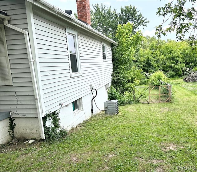 450 N Main St, Saint Clair, MO 63077 - view of property exterior with cooling unit and a chimney