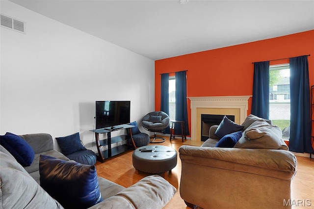 415 Crystal Trail Dr, Wentzville, MO 63385 - living area with a fireplace with flush hearth and wood finished floors