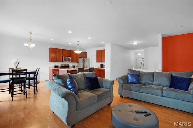 415 Crystal Trail Dr, Wentzville, MO 63385 - living area with light wood-style flooring, recessed lighting, and a chandelier