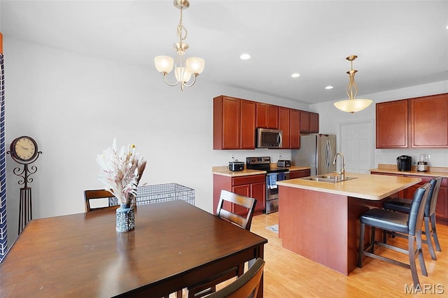 415 Crystal Trail Dr, Wentzville, MO 63385 - kitchen with appliances with stainless steel finishes, a chandelier, recessed lighting, decorative light fixtures, and light countertops