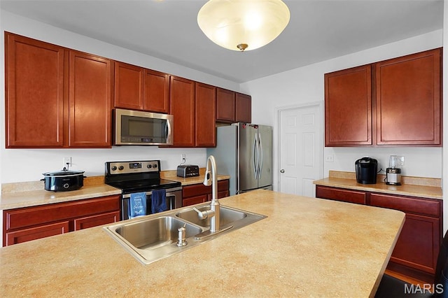 415 Crystal Trail Dr, Wentzville, MO 63385 - kitchen with stainless steel appliances, light countertops, and dark brown cabinets