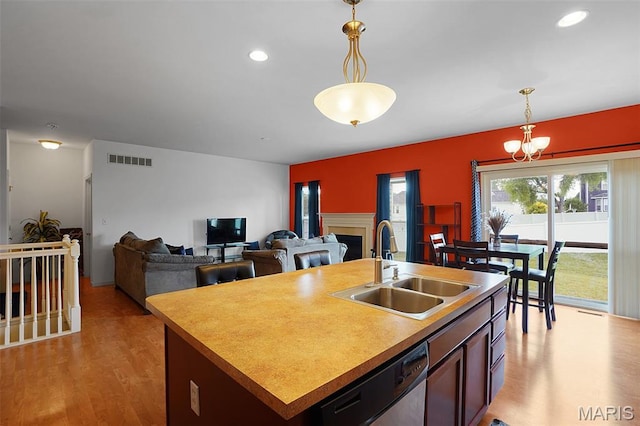 415 Crystal Trail Dr, Wentzville, MO 63385 - kitchen featuring dishwasher, a chandelier, hanging light fixtures, light wood finished floors, and recessed lighting