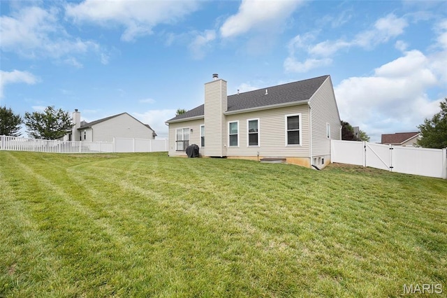 415 Crystal Trail Dr, Wentzville, MO 63385 - rear view of property featuring a chimney, a fenced backyard, and a gate