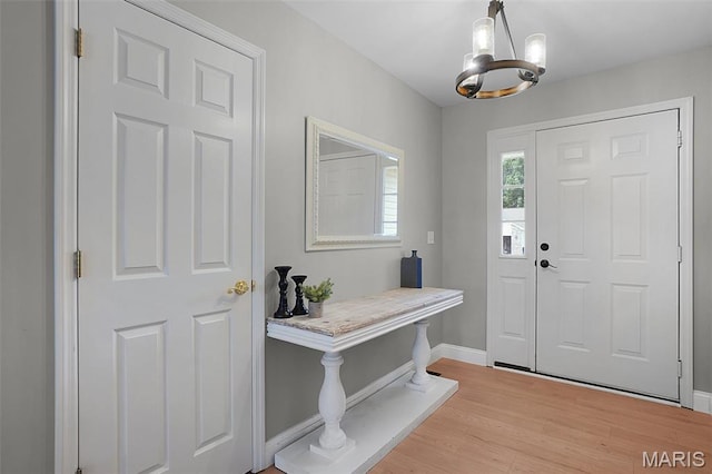 3837 Bedford Pointe Dr, Wentzville, MO 63385 - entryway featuring a chandelier and light wood finished floors