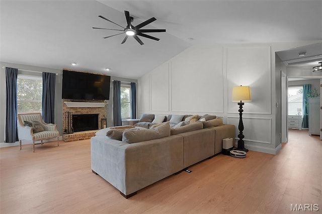 3837 Bedford Pointe Dr, Wentzville, MO 63385 - living room with a decorative wall, ceiling fan, plenty of natural light, light wood-type flooring, and vaulted ceiling