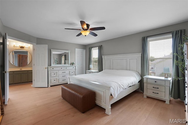 3837 Bedford Pointe Dr, Wentzville, MO 63385 - bedroom with light wood finished floors, a ceiling fan, and ensuite bath