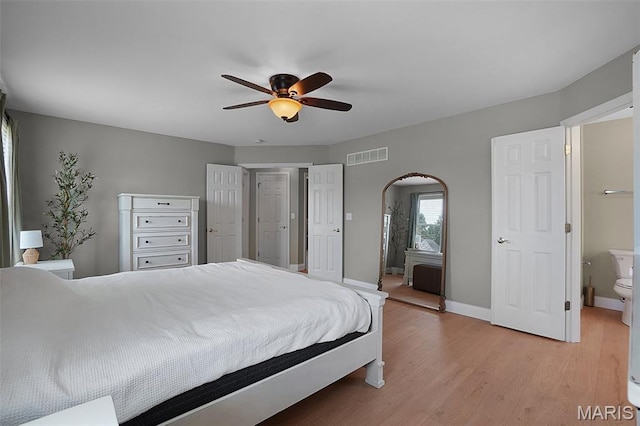 3837 Bedford Pointe Dr, Wentzville, MO 63385 - bedroom featuring arched walkways, light wood-style flooring, and ceiling fan