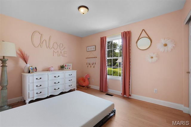 3837 Bedford Pointe Dr, Wentzville, MO 63385 - bedroom featuring baseboards and light wood-type flooring