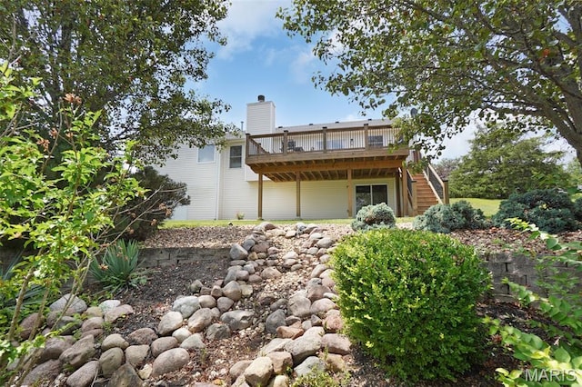 3837 Bedford Pointe Dr, Wentzville, MO 63385 - back of house featuring a wooden deck, stairs, and a chimney