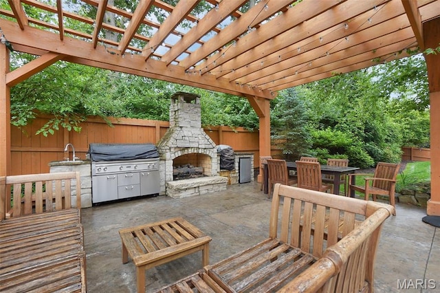 1316 Breezeridge Dr, Des Peres, MO 63131 - view of patio with an outdoor stone fireplace, a grill, and outdoor dining space