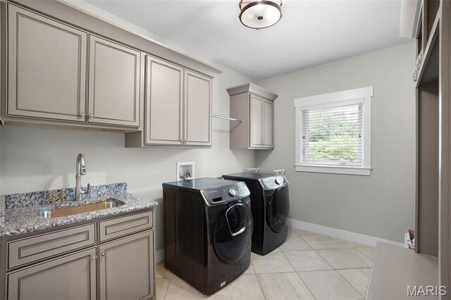 1316 Breezeridge Dr, Des Peres, MO 63131 - laundry room featuring washing machine and clothes dryer, cabinet space, baseboards, and light tile patterned floors