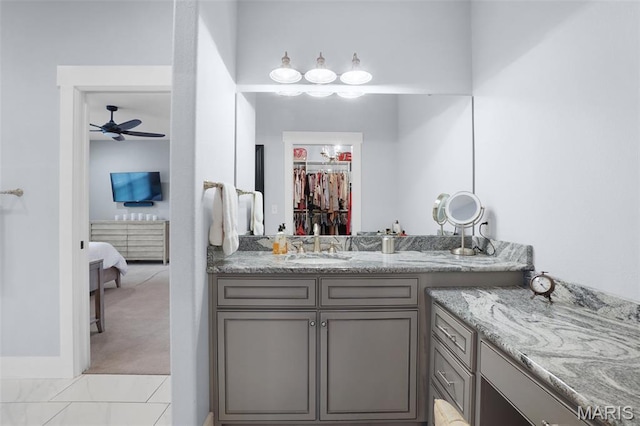 1316 Breezeridge Dr, Des Peres, MO 63131 - bathroom featuring a ceiling fan, ensuite bathroom, vanity, and a spacious closet