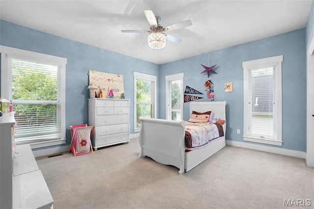 1316 Breezeridge Dr, Des Peres, MO 63131 - bedroom featuring light colored carpet, multiple windows, ceiling fan, and baseboards
