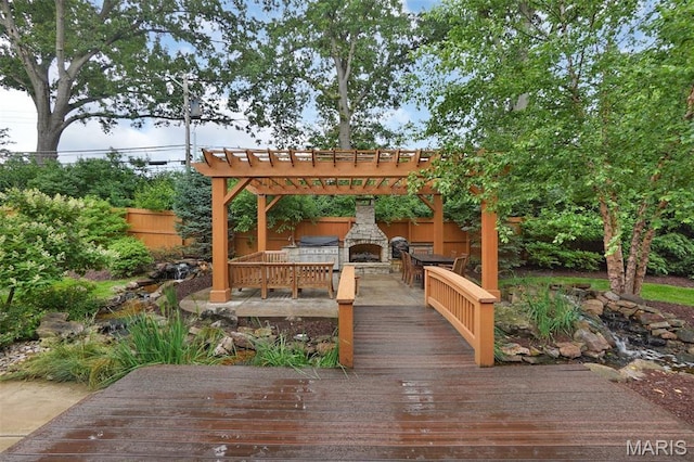 1316 Breezeridge Dr, Des Peres, MO 63131 - deck with an outdoor stone fireplace and grilling area