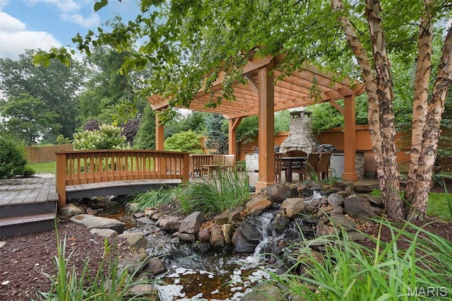 1316 Breezeridge Dr, Des Peres, MO 63131 - view of yard featuring a fireplace, a deck, and a pergola