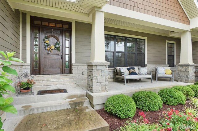 1316 Breezeridge Dr, Des Peres, MO 63131 - doorway to property featuring covered porch and stone siding