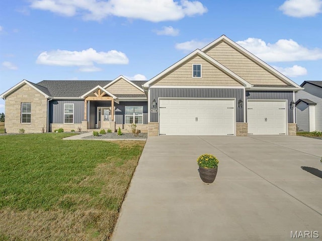 484 Hayden Dr, Waterloo, IL 62298 - craftsman inspired home featuring board and batten siding, stone siding, driveway, and a garage