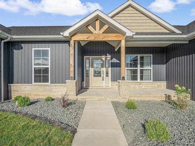 484 Hayden Dr, Waterloo, IL 62298 - doorway to property with a porch, stone siding, and a shingled roof