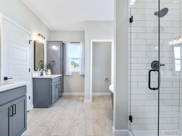 484 Hayden Dr, Waterloo, IL 62298 - full bathroom with vanity, a shower stall, a freestanding bath, and baseboards