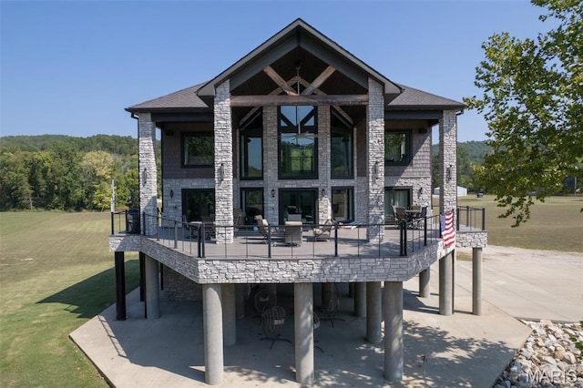 2262 Brown Rd, Van Buren, MO 63965 - back of property featuring a lawn, a deck, and a patio