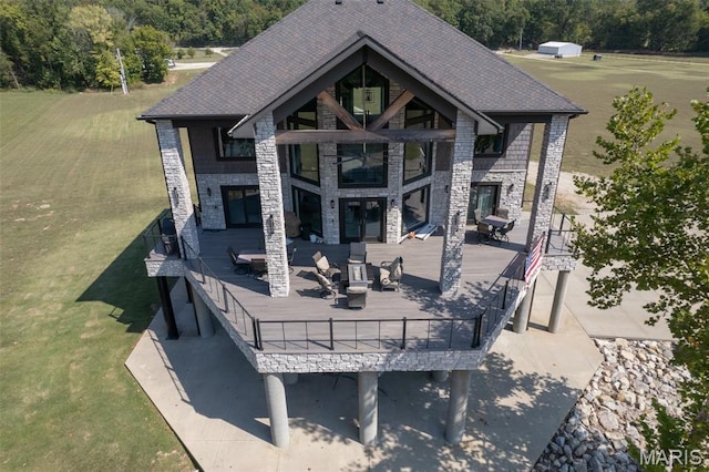 2262 Brown Rd, Van Buren, MO 63965 - back of house with an outdoor living space with a fireplace, a deck, stone siding, and a wooded view