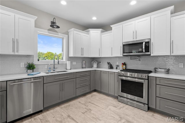 2262 Brown Rd, Van Buren, MO 63965 - kitchen featuring stainless steel appliances, a sink, gray cabinetry, light countertops, and recessed lighting