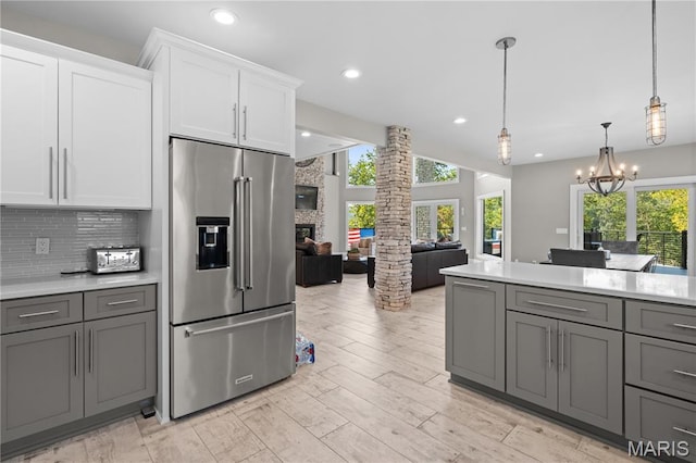 2262 Brown Rd, Van Buren, MO 63965 - kitchen with high quality fridge, gray cabinets, plenty of natural light, light countertops, and recessed lighting