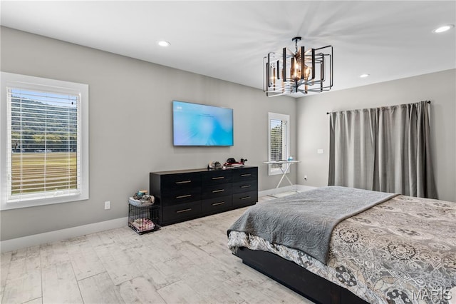 2262 Brown Rd, Van Buren, MO 63965 - bedroom featuring multiple windows, baseboards, a chandelier, light wood-type flooring, and recessed lighting