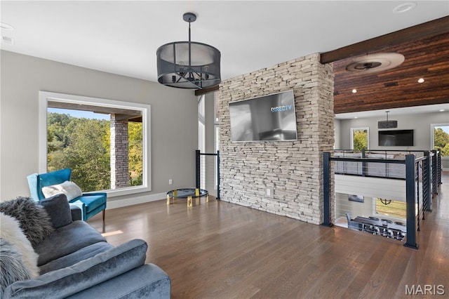 2262 Brown Rd, Van Buren, MO 63965 - living area featuring wood finished floors, baseboards, and beam ceiling