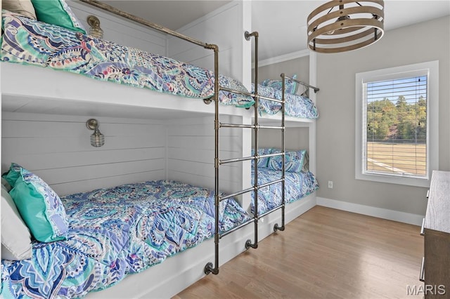 2262 Brown Rd, Van Buren, MO 63965 - bedroom with wood finished floors, baseboards, and ornamental molding