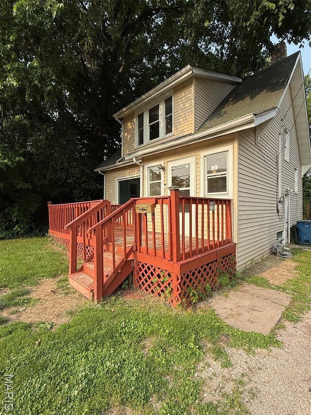 2213 Johnson St, Alton, IL 62002 - rear view of house featuring a wooden deck, a yard, and a chimney