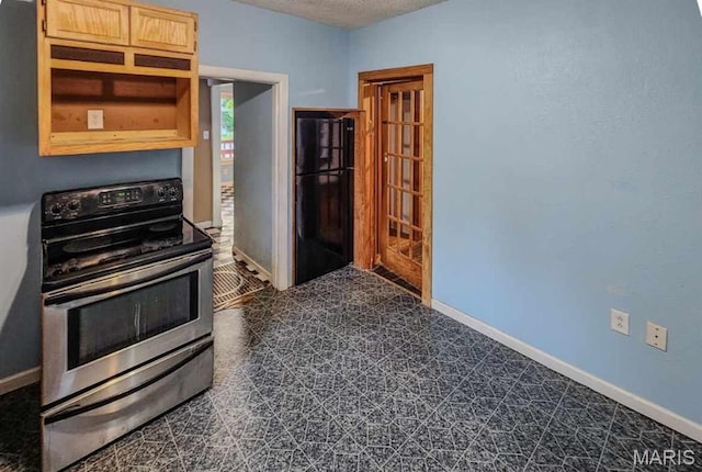 2213 Johnson St, Alton, IL 62002 - kitchen with freestanding refrigerator, stainless steel range with electric cooktop, baseboards, a textured ceiling, and dark flooring