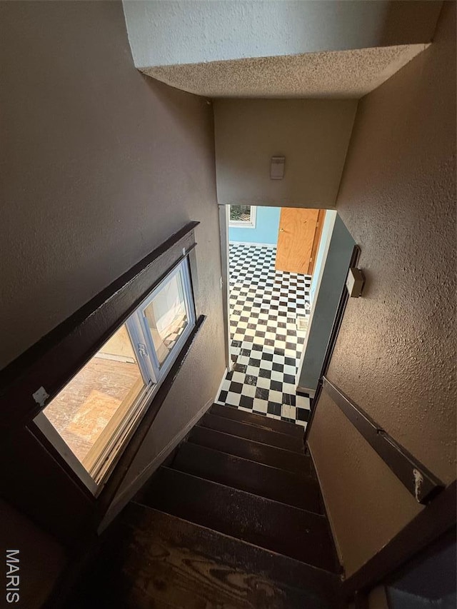 2213 Johnson St, Alton, IL 62002 - stairs featuring a textured wall and wood finished floors