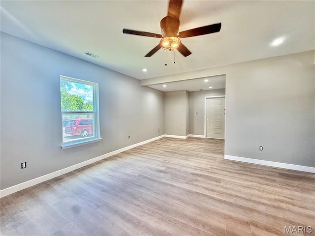 500 W Pacific St, Pacific, MO 63069 - empty room with light wood-style floors, ceiling fan, and recessed lighting