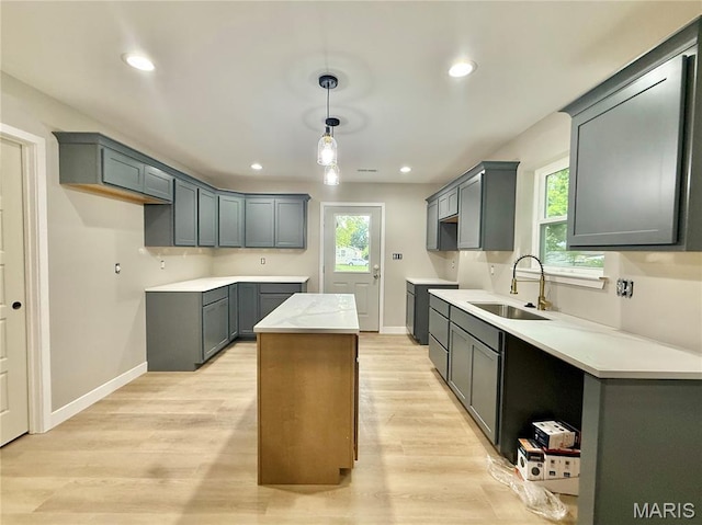 500 W Pacific St, Pacific, MO 63069 - kitchen featuring light wood finished floors, recessed lighting, decorative light fixtures, and gray cabinetry