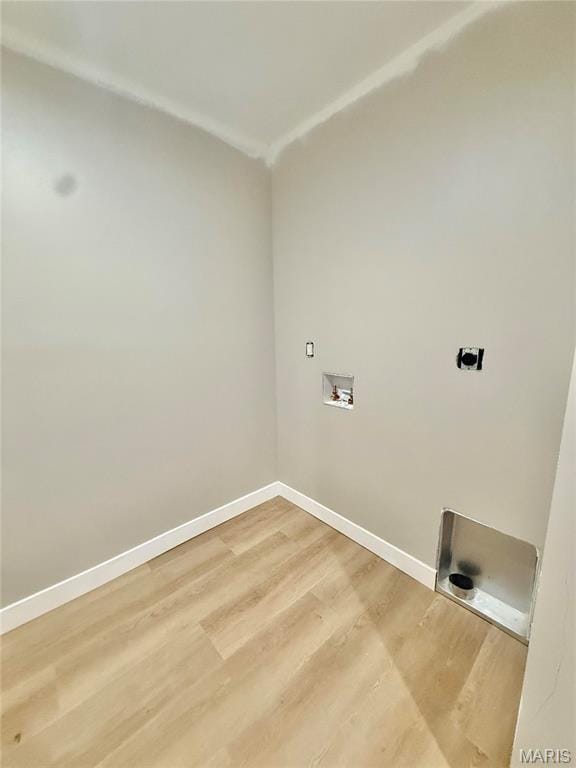 500 W Pacific St, Pacific, MO 63069 - washroom featuring hookup for a washing machine, hookup for an electric dryer, and light wood finished floors