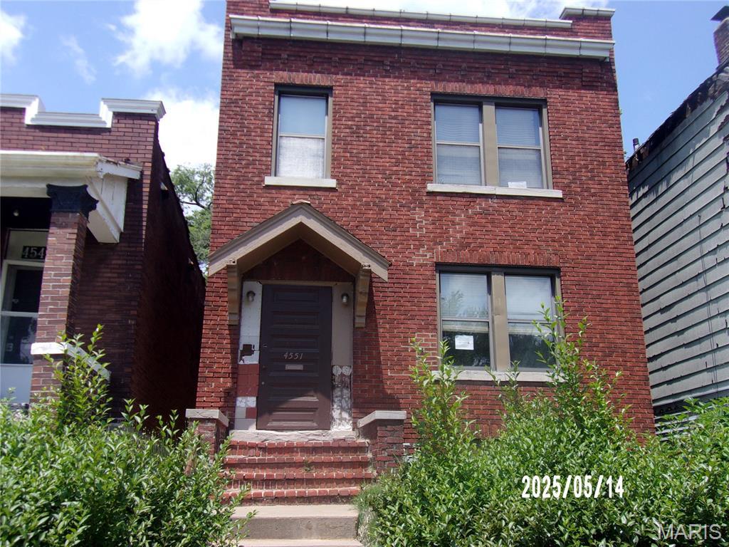 4551 Alcott Ave, Saint Louis, MO 63120 - view of front facade featuring brick siding